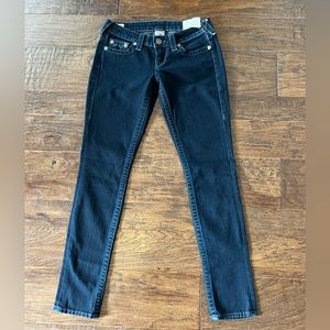 Dark wash, lower rise True religion jeans.